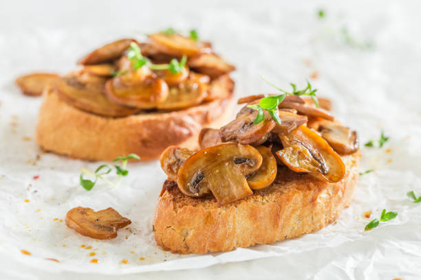 Tasty and fresh bruschetta with mushrooms for breakfast. Italian cuisine for breakfast.