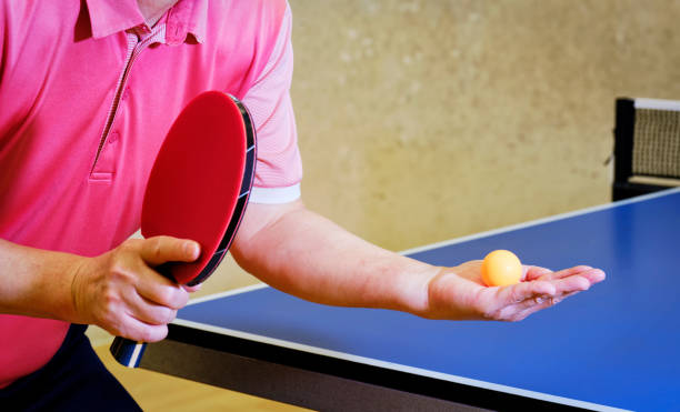 istock Man playing ping pong table tennis 1406489836