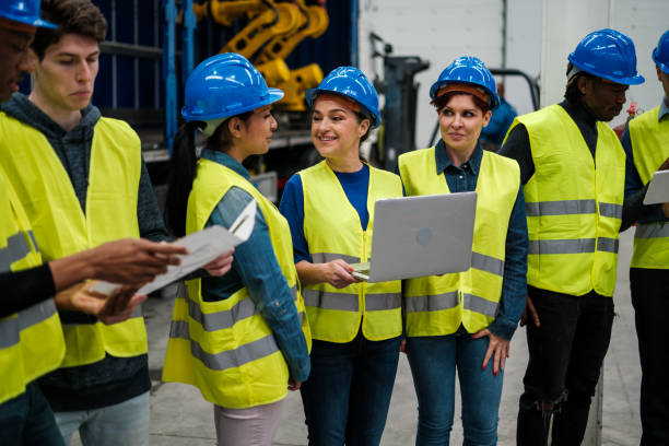istock Group of engineers in an innovation company talking about robotics 1406489840