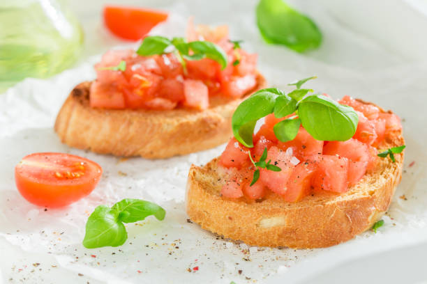 istock Fresh and hot bruschetta with basil and tomatoes for breakfast. 1406489855