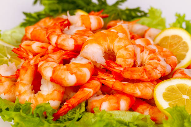 istock Appetizing dish with boiled shrimp, lettuce and lemon. 1406489869