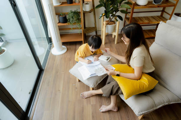 istock Happy mother talking to her baby while working at home 1406492530
