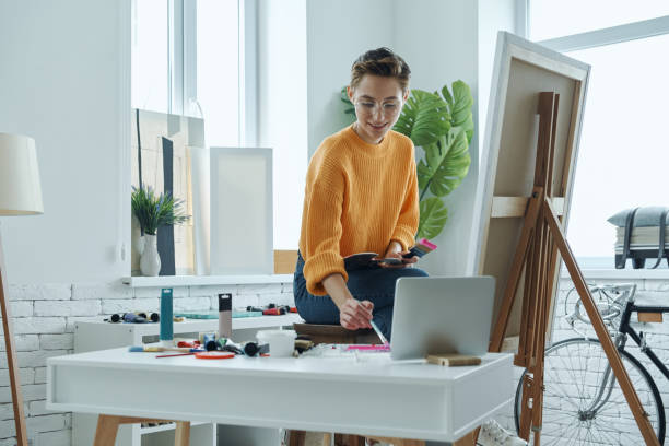 istock Confident young woman mixing colors 1406492728