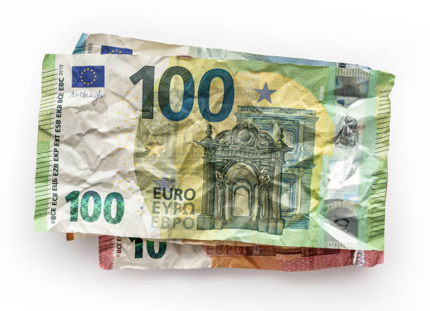 istock Stack of old crumpled European banknotes isolated on white background 1406493949