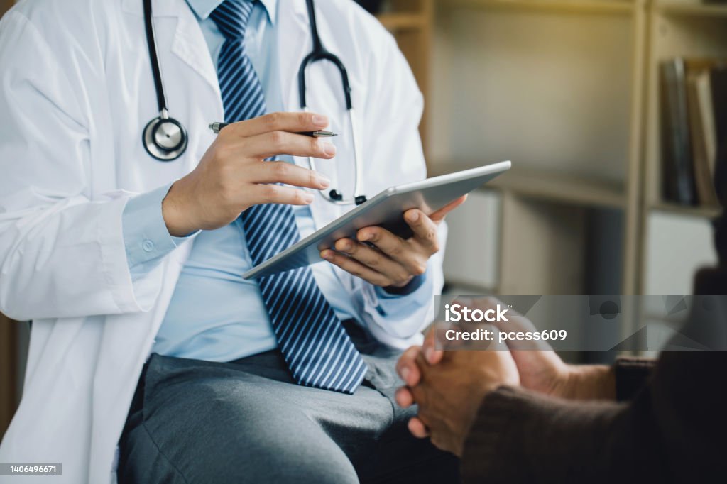 Psychiatrist or professional psychologist counseling or therapy session to male patients suffering from mental health problems. due to economic failure after the COVID-19 pandemic. PTSD Mental health. Doctor Stock Photo
