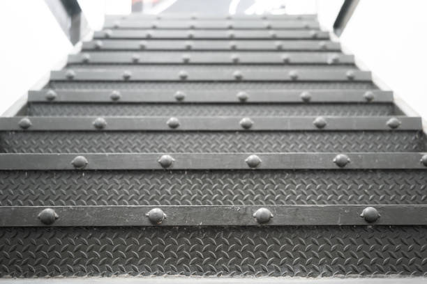 istock Metallic stair step up to the higher floor - Building interior. 1406497873