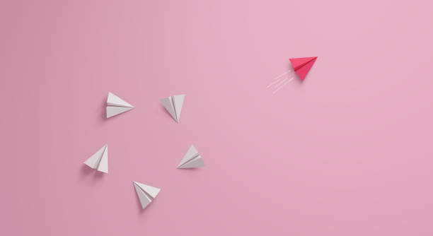 Women's leadership concept. Individual and unique leader pink paper airplane changing direction. Women's leadership concept. Individual and unique leader pink paper airplane changing direction. 3d rendering. individual event stock pictures, royalty-free photos & images