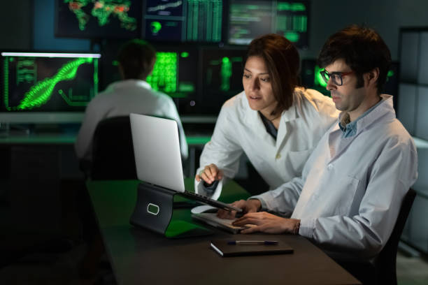 istock Multiracial medical research team working in lab using laptop. Analyzing results. 1406500261