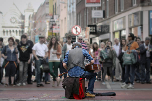 Dublin, Ireland - 07 22 2012. Talented folk musician plays the guitar on his lap in the streets of Dublin.