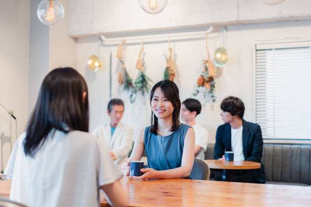 istock Two women talking in a cafe 1406500641