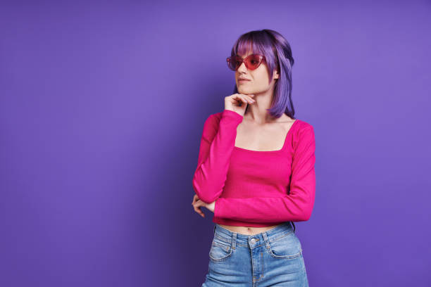 istock Thoughtful young woman holding hand on chin 1406500717