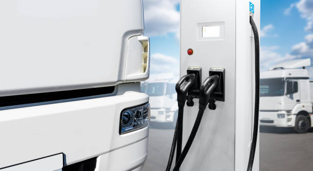 istock Electric truck with charging station. 1406501402