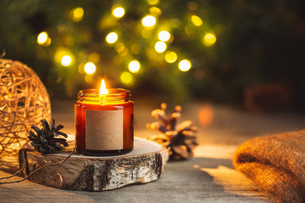 istock Holiday candle in a glass jar with label mock up 1406501777