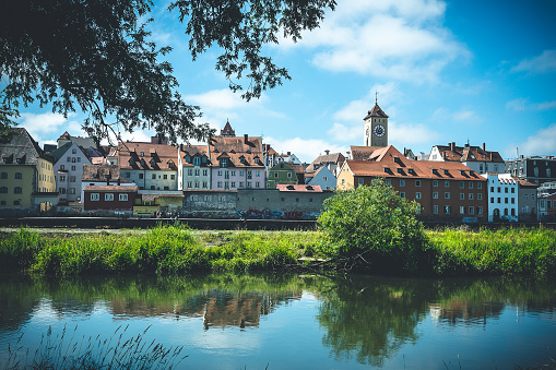 A view of the Regensburg skyline and a church across the Danube river