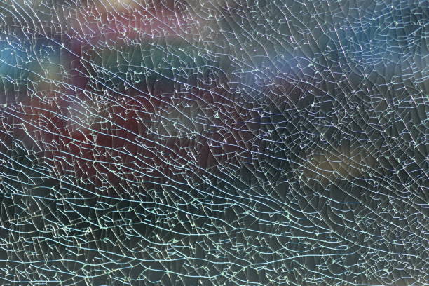 close up of a shattered glass fence in the city. - broken glass green shattered glass imagens e fotografias de stock