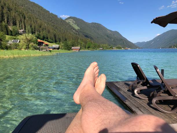 istock Relax in a lounger on the lake shore 1406504055