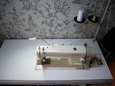 Professional sewing machine at home. Sewing machine for work.