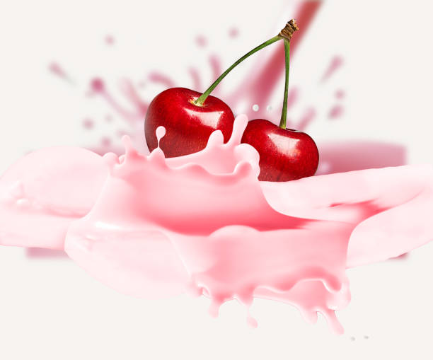 istock Cherry is falling into milk. Splash isolated on white 1406508854