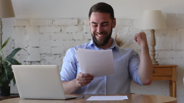 Focused freelance business man reading paper document