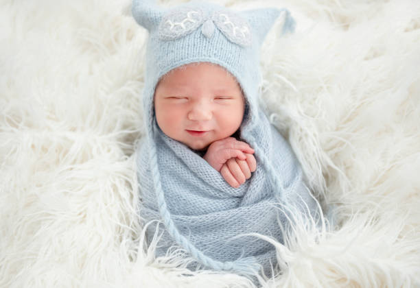istock Cute newborn in knitted suit 1406510361