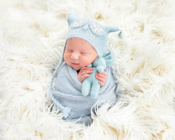 istock Cute newborn in knitted suit 1406510366