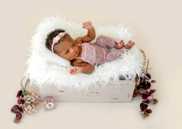 istock Newborn baby in cradle 1406510596