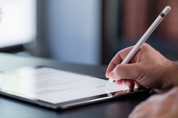istock Businessman Signing Digital Contract On Tablet 1406511034
