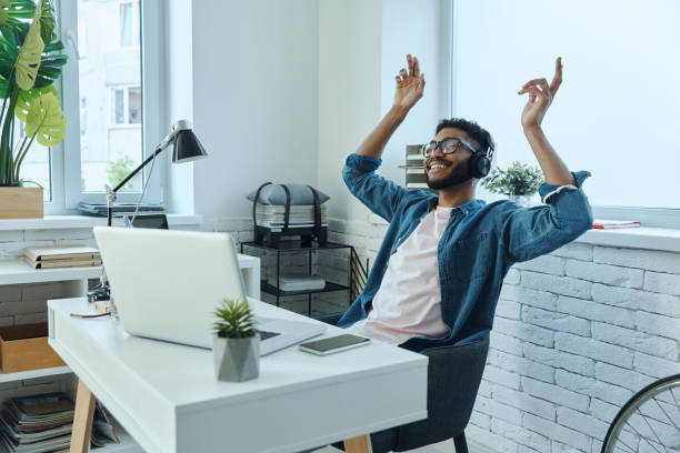 istock Relaxed African man in headphones gesturing 1406511449