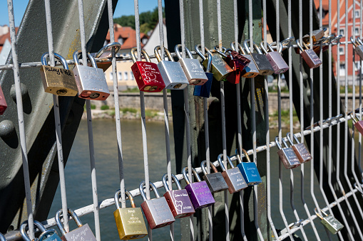 Love locks at the iron bridge in Regensburg in Bavaria