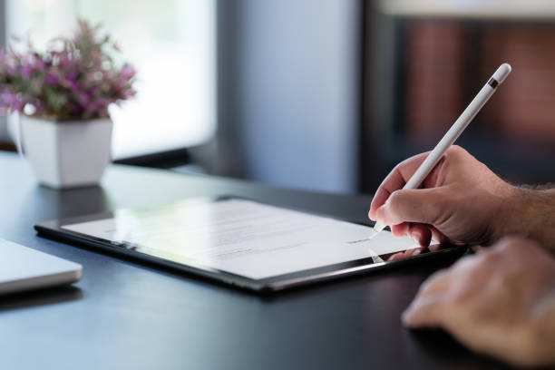 istock Businessman Signing Digital Contract On Tablet 1406511796