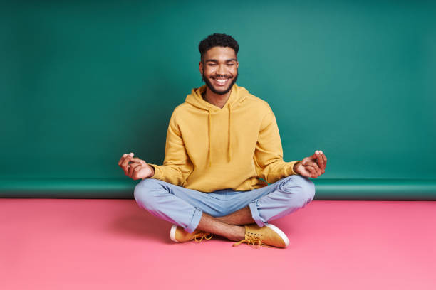 Happy African man meditating