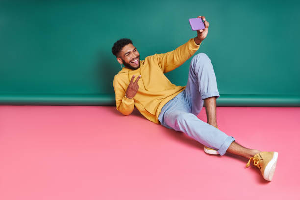 istock Playful African man making selfie and grimacing 1406512935