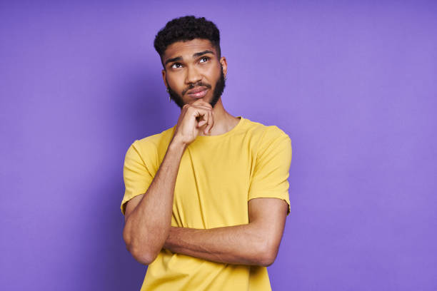 istock Thoughtful African man holding hand on chin 1406514267