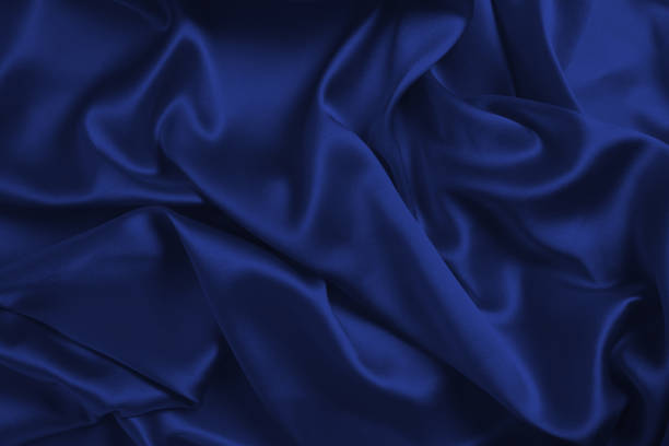 istock Rich and luxury red silk fabric texture background. 1406514400