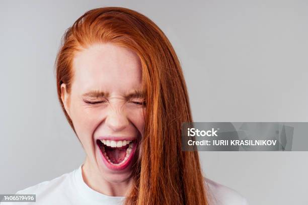 Redhaired Ginger Student Woman With Open Mouth And Bad Teeth Stock Photo - Download Image Now