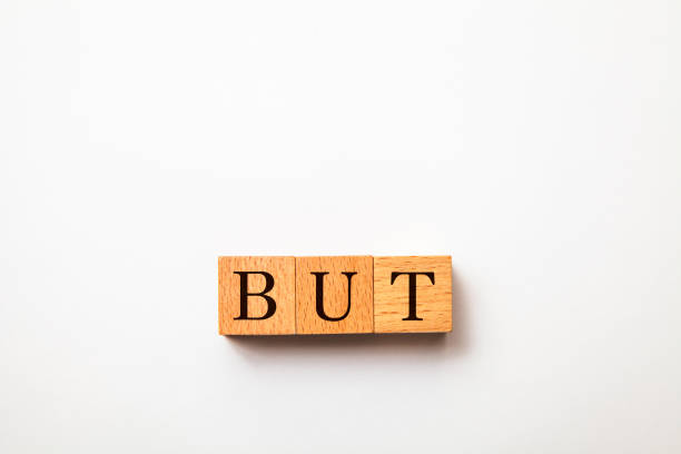 istock BUT character. However. Written on three wooden blocks. Black letters. 1406520168
