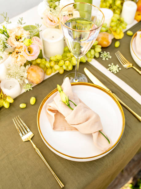 istock Festive colourful table setting. Restaurant, wedding, party decorated with flowers, candles, fruits and leaves. Midsummer or autumn mood event, romantic dinner. Florist decorator occupation. 1406521009