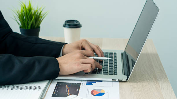 istock businessman hands working on laptop computer data analysis financial chart review online work concept 1406521339