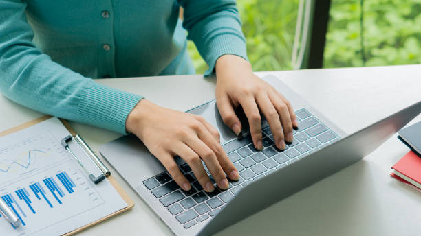 istock businessman hands working on laptop computer data analysis financial chart review online work concept 1406521342