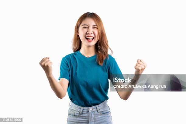 Portrait Of An Asian Woman Smiling And Extending Her Hand To Present Something With Hands Gesturing Isolated Copy Space On White Background Stock Photo - Download Image Now