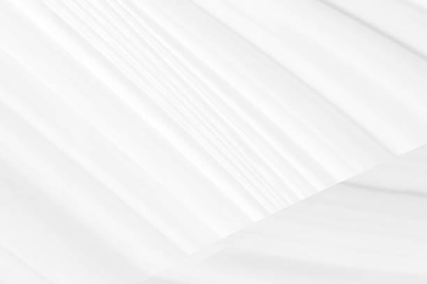 istock Clean woven beautiful soft fabric abstract smooth curve shape decorative fashion textile silver white background 1406523349