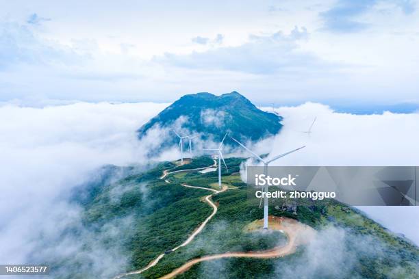 High Mountains Sea Of Clouds And Wind Turbines Stock Photo - Download Image Now - Sustainable Resources, Wind Turbine, Windmill