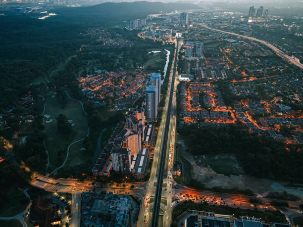 evening drone point of view intersection of suburb with settlement and golf course
