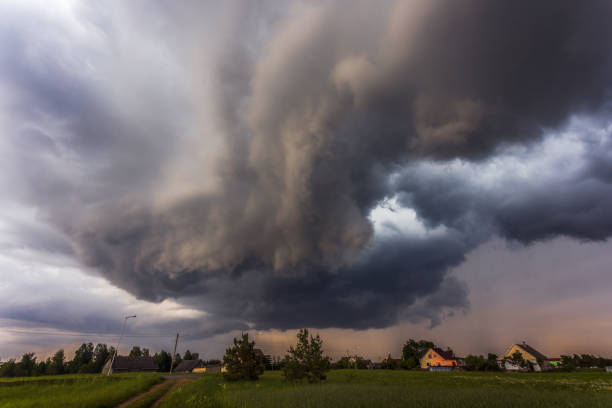 istock Storm clouds over field, tornadic supercell, extreme weather, dangerous storm 1406523667
