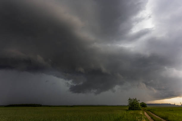 istock Storm clouds over field, tornadic supercell, extreme weather, dangerous storm 1406523680