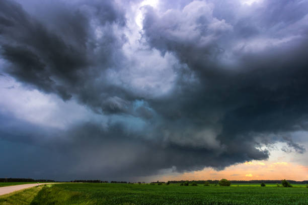 istock Storm clouds over field, tornadic supercell, extreme weather, dangerous storm 1406523718
