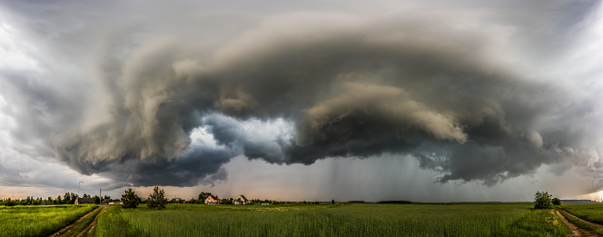 Storm clouds over field, extreme weather, dangerous storm in Europe, LithuaniaStorm clouds over field, tornadic supercell, extreme weather, dangerous storm in Europe, Lithuania