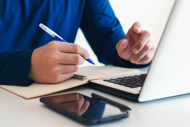 istock Businessman taking notes Summarize the meeting online with laptop. 1406524860