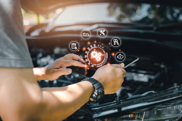 istock Car business concept and technology on virtual screen, Serviceman working onsite use tablet check service cycle for maintenance of car with the engine room in the background, Smart work of car service 1406527479