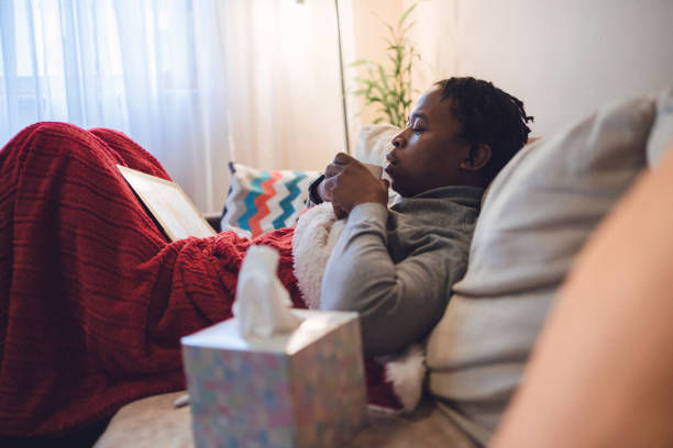 istock Young ill African-American man having interaction with doctor over digital tablet 1406529026